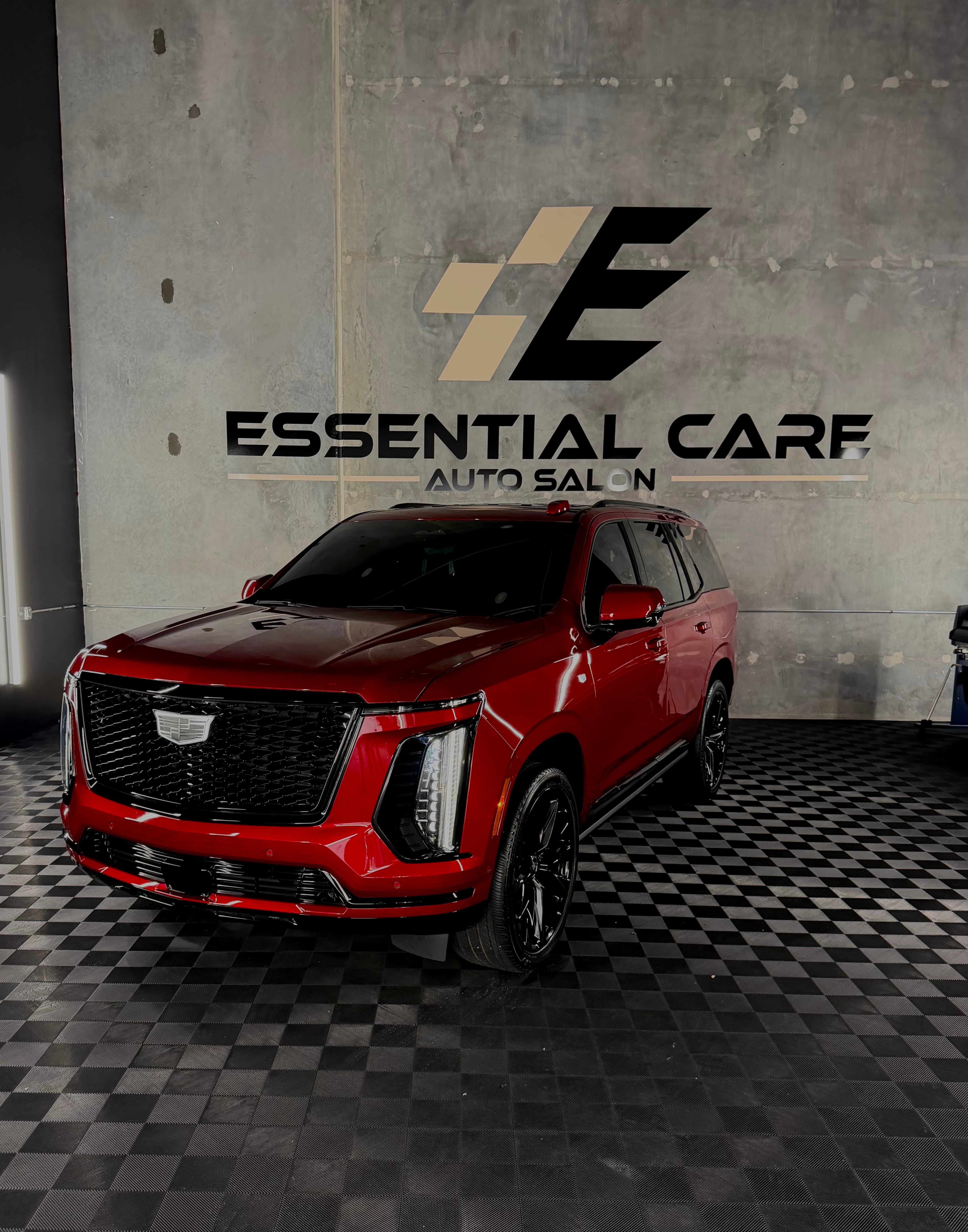 Essential Care Auto Salon shop interior with luxury vehicle