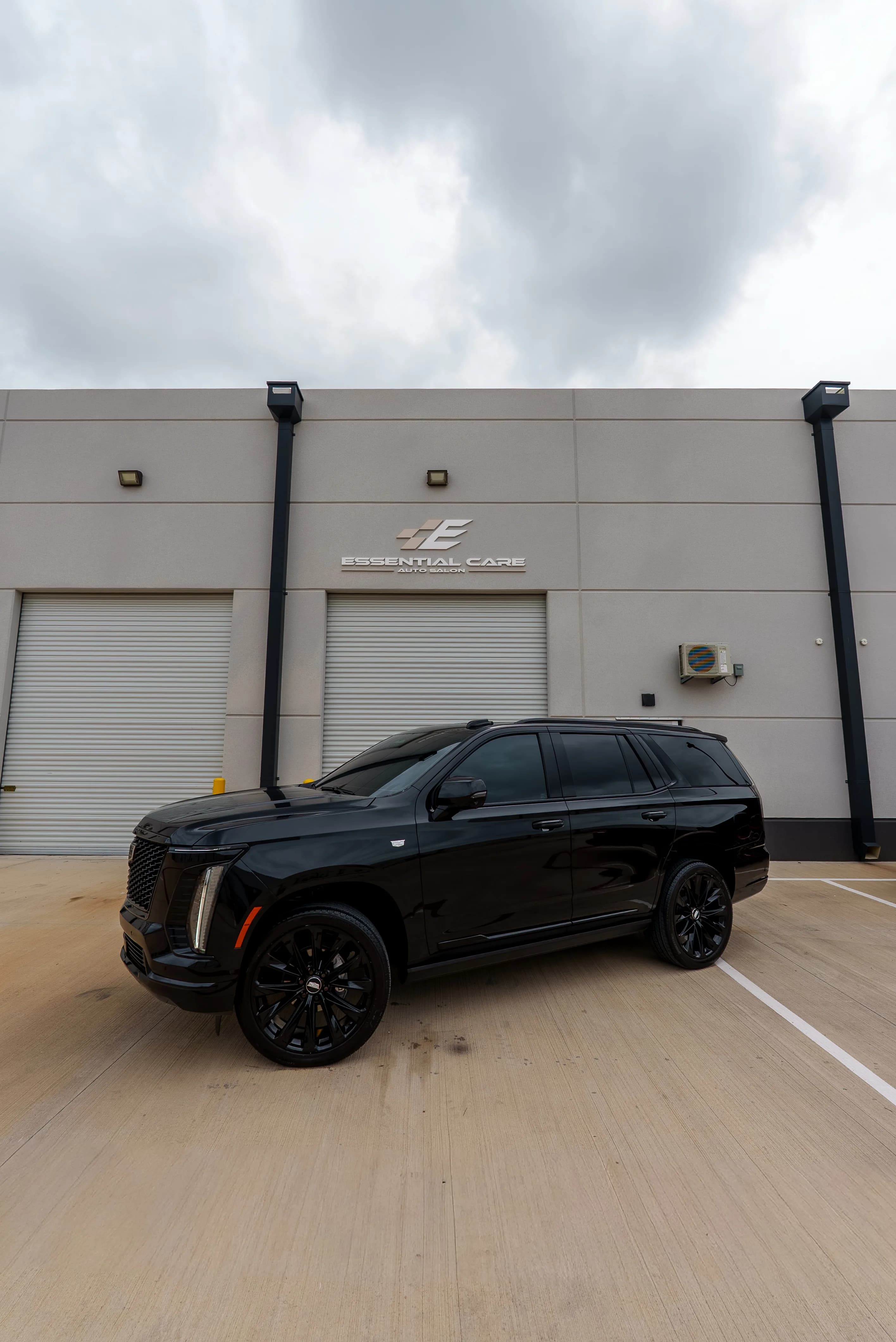 Blacked-out Cadillac Escalade with window tint