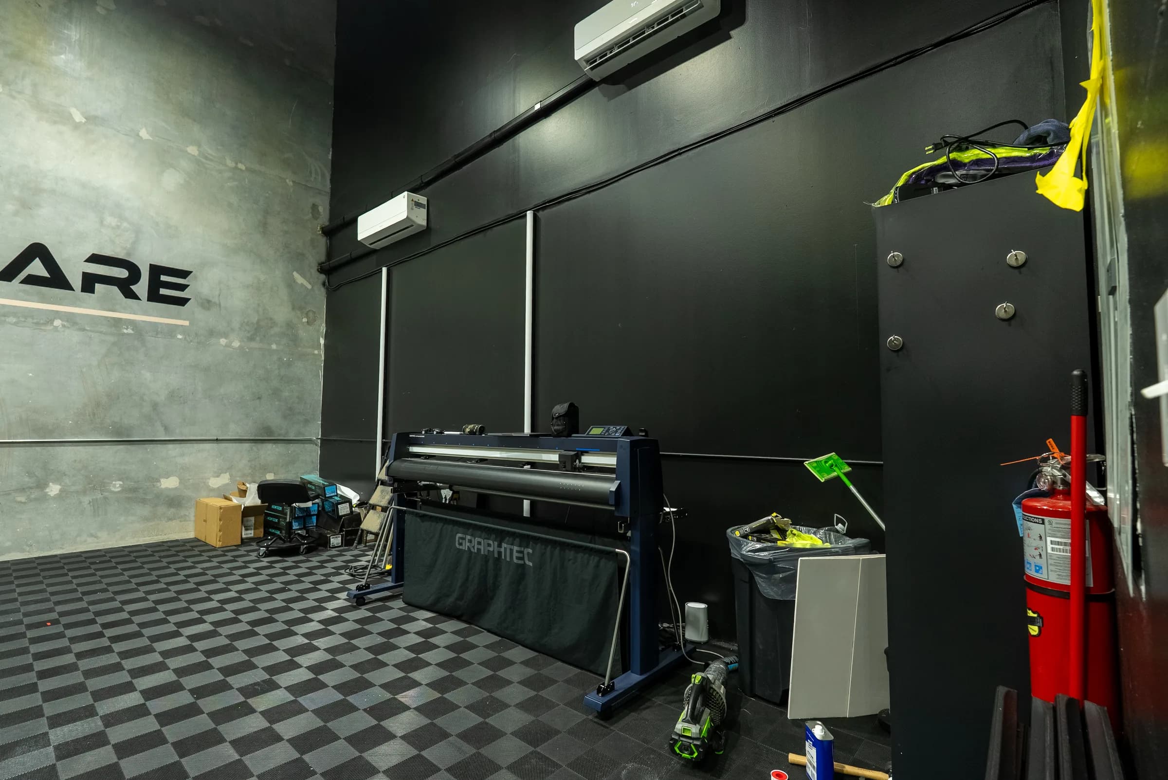 Install bay workstation with vinyl plotter, tool cabinets, and supplies